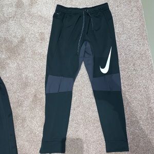 Black Nike joggers.